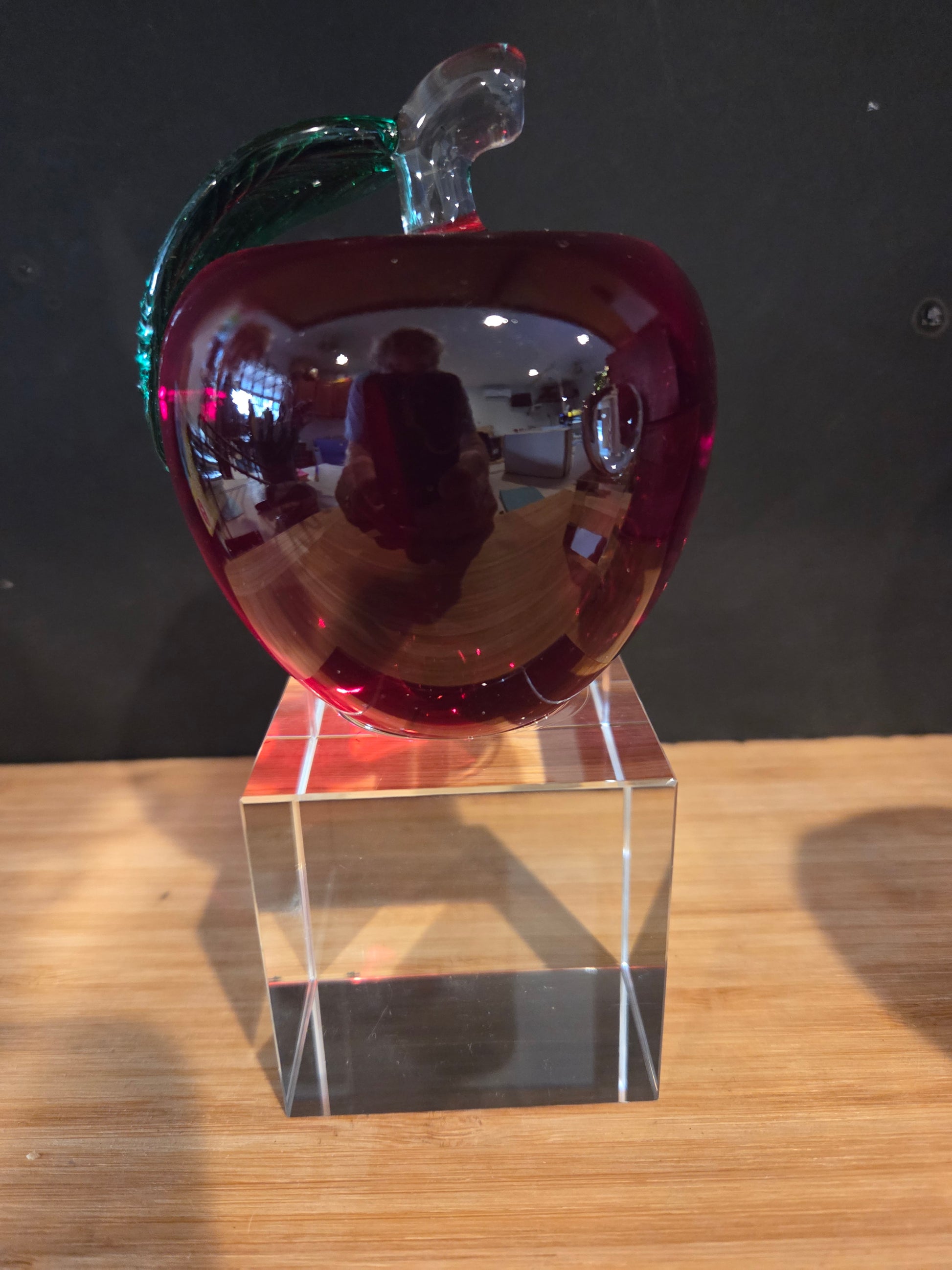 Red apple on a clear crystal base